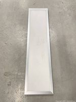 Front view of rectangular LED panel showing diffuser and aluminum frame