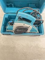 Makita N1923B planer inside blue carry case