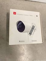 Box top showing YI Outdoor Camera 1080p branding