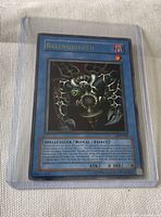Front view of Relinquished card inside hard sleeve