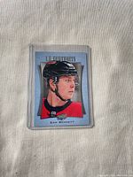 Front of Sam Bennett UD Portraits card in sleeve