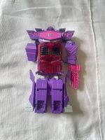 Front view of Shockwave figure laying flat
