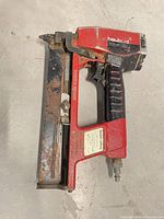 Full view of Haubold Kihlberg red/black pneumatic stapler
