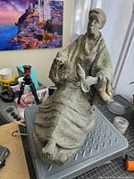 Full view of bronze sculpture on table