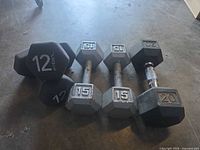 overview of all dumbbells on concrete floor