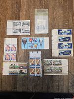Group shot of all stamp blocks and strips on wooden surface