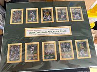 Front view showing entire 16x20 matted display with ten cards and title plaque