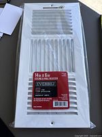 Front view of sealed 14" x 6" Everbilt ceiling & wall register in packaging