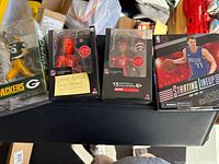 Group shot of all four sealed figures on table