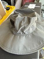 Top view of gray Columbia sun hat showing full brim and logo