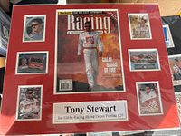 Front view of matted Tony Stewart magazine cover and trading cards display