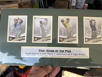 Front view of matted display showing all four golf cards and title strip
