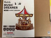 Front of sealed Rolife Music Dreamer Classic Carousel puzzle box showing artwork and specifications