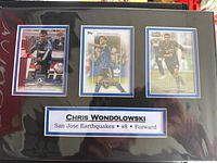 Front view of matted display with three cards and nameplate