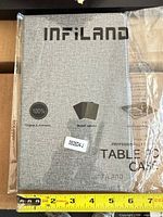 Front view of packaged Infiland tablet case with branding visible