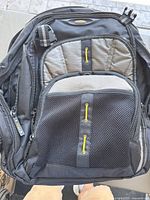 Front view showing colour, front mesh pocket, zippers, yellow accent pulls