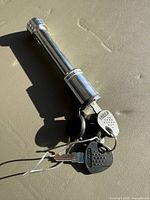 Chrome trailer hitch lock pin with two keys attached