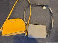 Yellow and taupe Steve Madden crossbody purses side by side