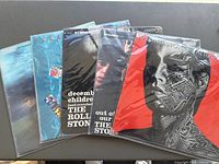 All five LPs overlapped showing front jackets in sleeves