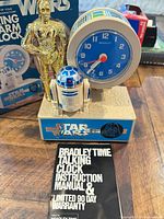 Front view of Bradley Time Star Wars talking alarm clock, instruction manual and box