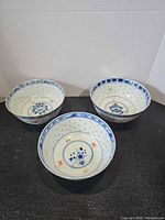 Top view of three bowls showing interior patterns