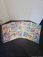 Front view of three binder pages filled with baseball cards