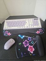 Top view showing keyboard, wrist rest, mouse pad and mouse