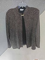 Full view of Graff sequin jacket hanging