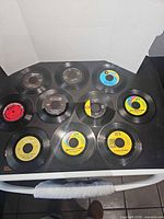 Ten 45 RPM records laid out for overview