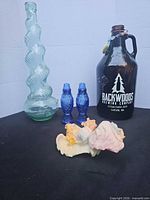 Group shot showing vase, growler, shakers, angel