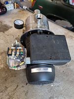 Water pump front view showing stainless housing, pressure gauge, pressure switch, and motor label 3/4 HP