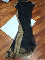 Full length view of folded black/olive mesh net