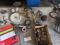 Bench with buffing wheel, grinding wheel, conditioning wheel, flap wheel, sanding sleeves, couplers