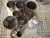 Top view showing all metal containers inside wire basket, including SodaStream cylinder and various cups