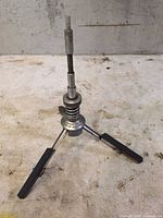 Full view of the adjustable cylinder hone standing on three arms