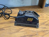Front view of Drill Doctor XPC sharpener showing logo and ventilation slots