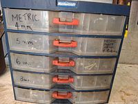 Front view of Mastercraft organizer cabinet showing five labeled drawers