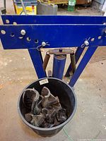 Pipe bender frame with bucket of dies