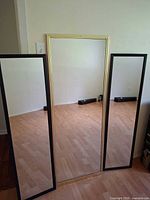 Front view of all three mirrors standing side by side