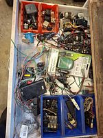 Top view of drawer showing various relays, wiring, fuse blocks, motors in trays