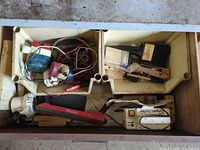 Drawer view with pumps, paint brushes, rasp and suction unit