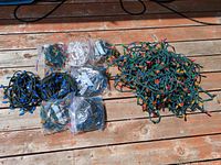 All bundled strands laid out on deck showing quantity, cord colors and multicolor bulbs
