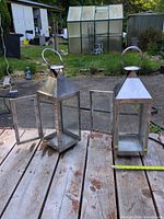 Both lanterns front doors open showing interiors