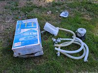 Box for Summer Waves 15 ft pool with accessories on grass