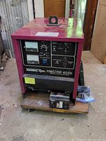 Front view of welder showing meters, controls, model designation