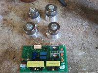 PCB and four transducers on workbench