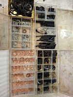 overview of three compartment organizers showing copper washers, tooth lock washers, roll pins, e-clips