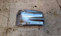 Front view of chrome Ronson Varaflame lighter showing wear