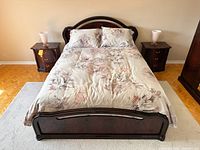 Bed fully assembled between two matching nightstands