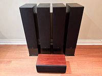 Front view of four tower speakers and centre channel